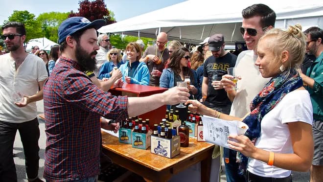 beer pouring in front of a crowd